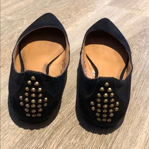 Women’s black flats with gold heel detail